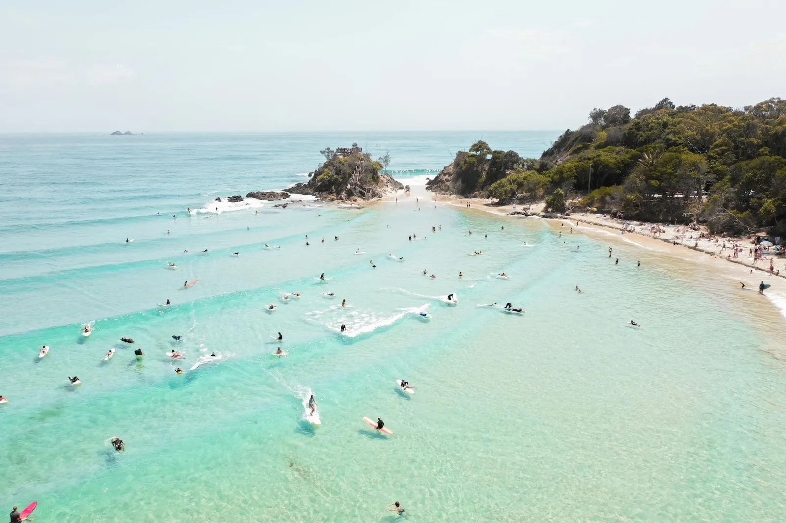 Aerial view of a turquoise surf bay on the South Lombok coast.